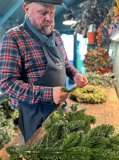 Florist with moss ring and foliage