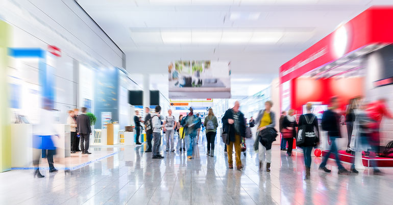 Tradeshow hallway with exhibitor spaces.