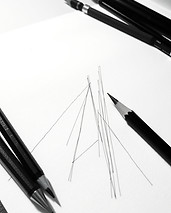 pencil and paper with lines as sketches.jpg