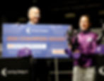 Nicola Currie receiving the 2025 Champion Jockey trophy on behalf of Richard Kingscote