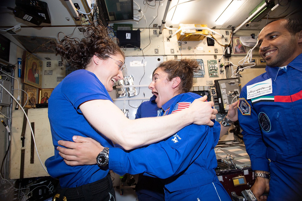 Astronauts Koch and Meir embrace aboard the ISS