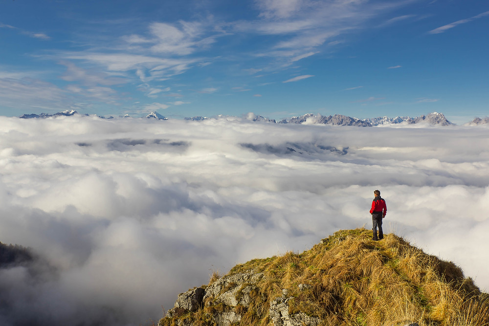 Person standing on mountaintop qigong training