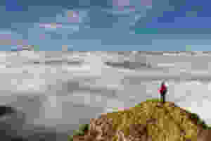 Person standing on mountaintop qigong training