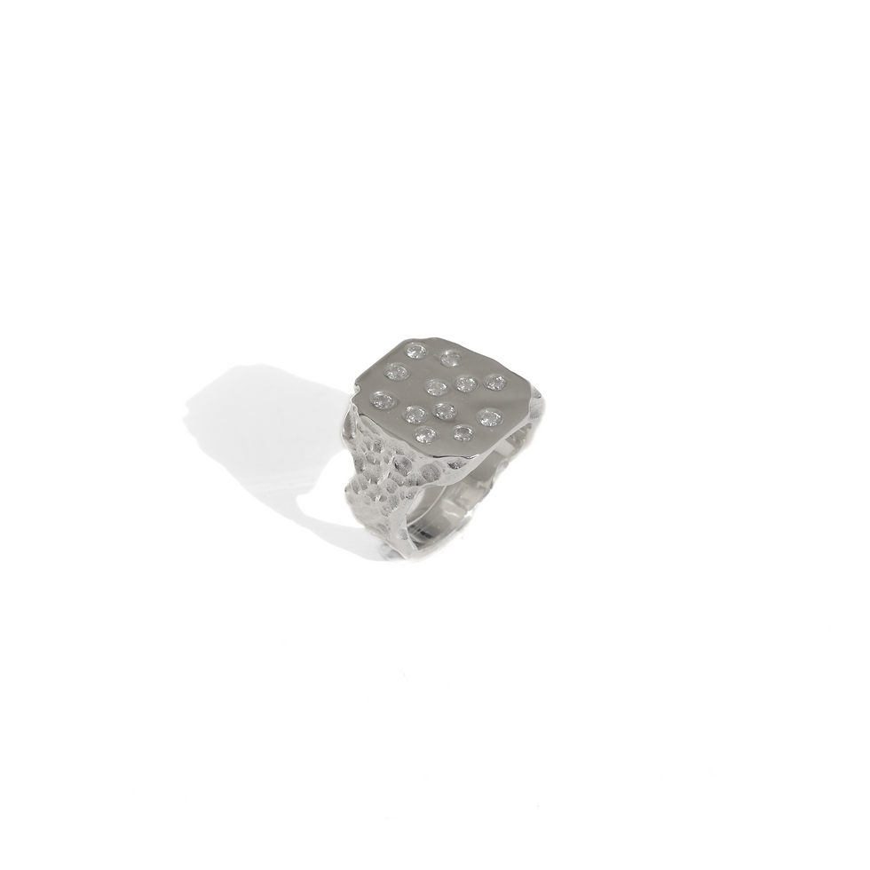 Thumbnail: Sterling silver ring with asymmetrical polished face and 12 diamond stones on a raw textured band.