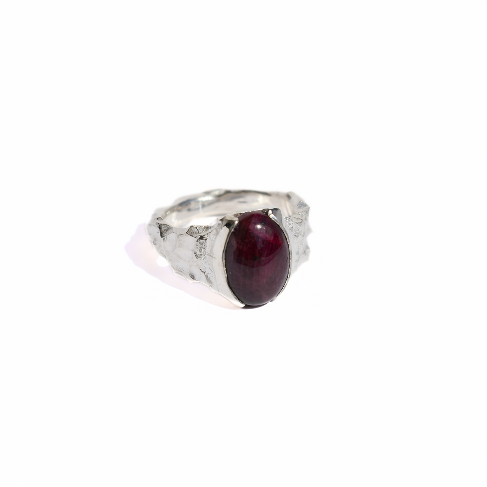 Thumbnail: Sterling silver ring with an oval cabochon ruby, set in a bold and raw organic handcrafted texture.