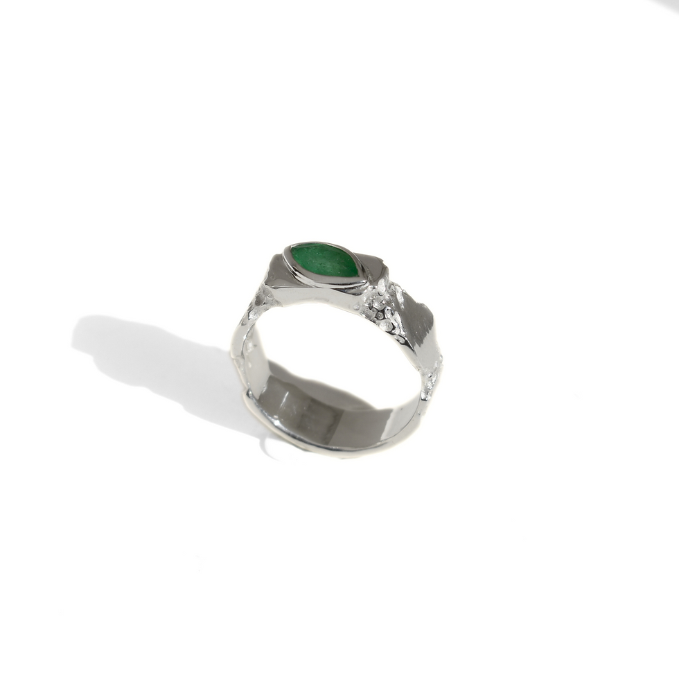 Thumbnail: Silver ring with marquise emerald and rough texture, blending raw nature with refined elegance.