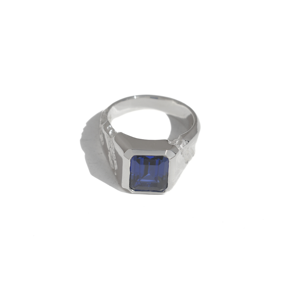 Thumbnail: Handmade silver ring with 10x8 mm lab sapphire, emerald cut, bold modern design with textured band.