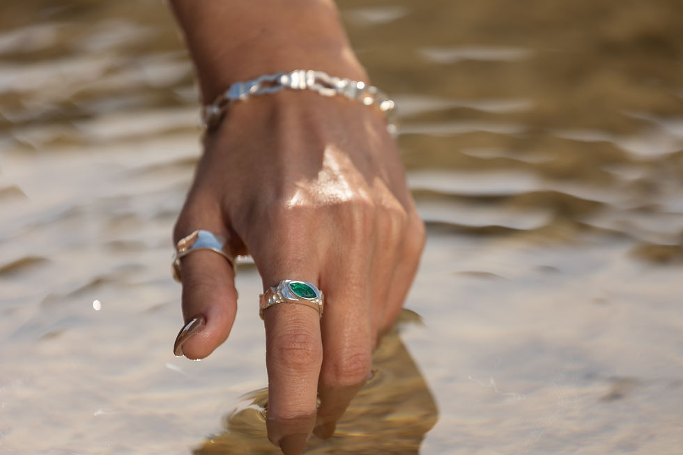 Thumbnail: Silver ring with marquise emerald and rough texture, blending raw nature with refined elegance.