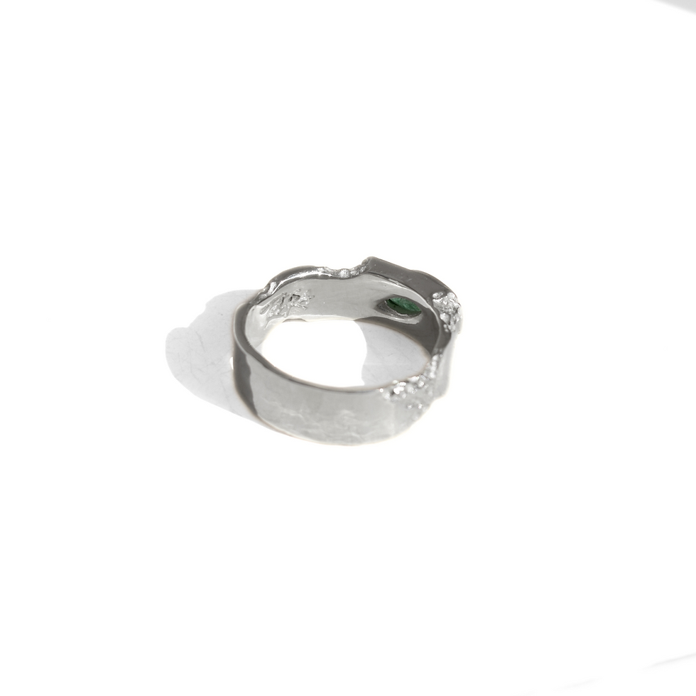 Thumbnail: Silver ring with marquise emerald and rough texture, blending raw nature with refined elegance.