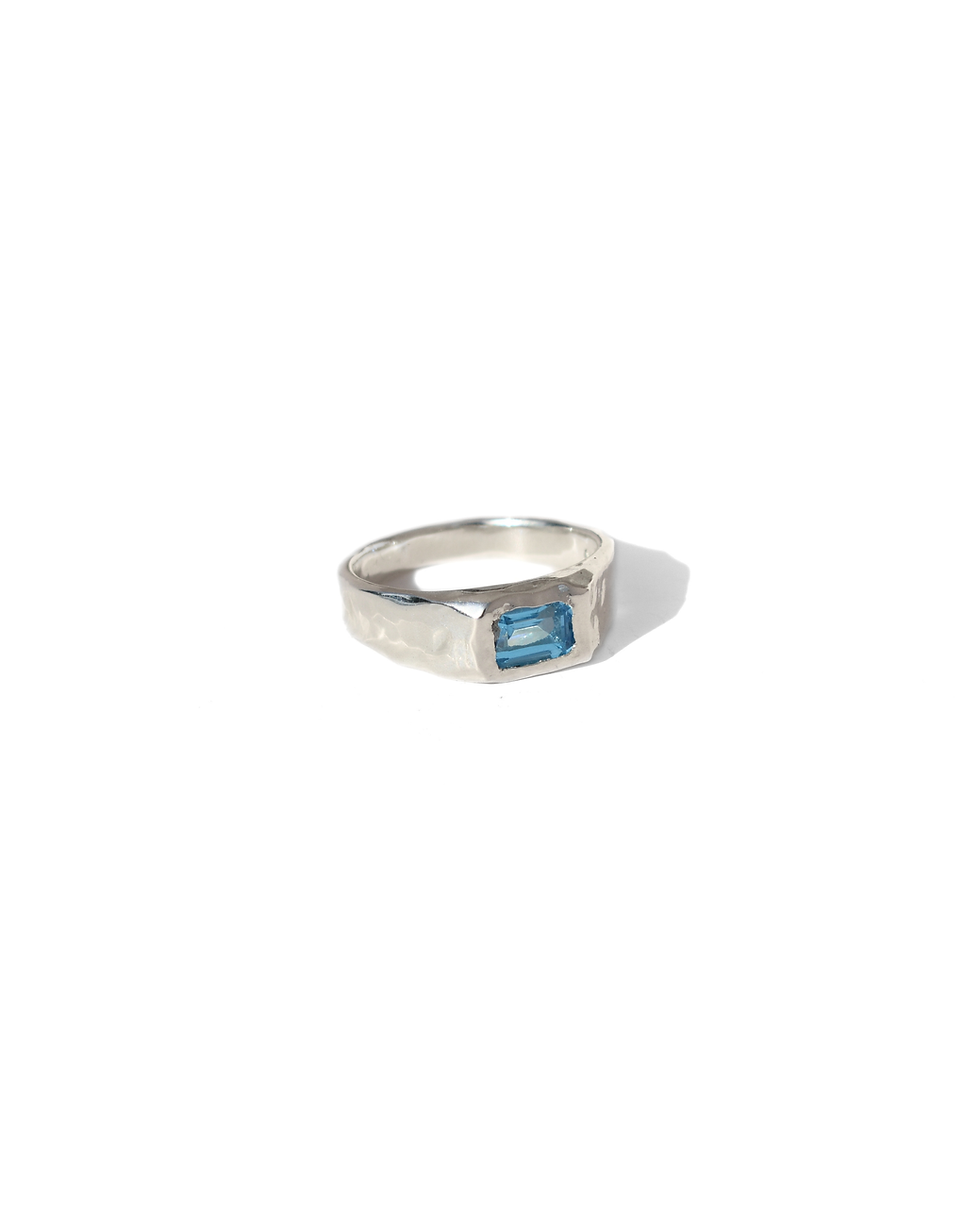 Thumbnail: Handmade sterling silver ring with rectangular blue topaz, polished organic gemstone band with sculptural silver design