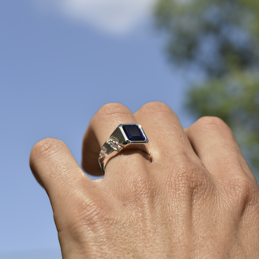 Thumbnail: Handmade silver ring with 10x8 mm lab sapphire, emerald cut, bold modern design with textured band.