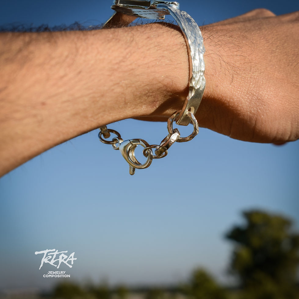 Thumbnail: Guitar pick silver bracelet with round flat tiger eye stone in the middle
