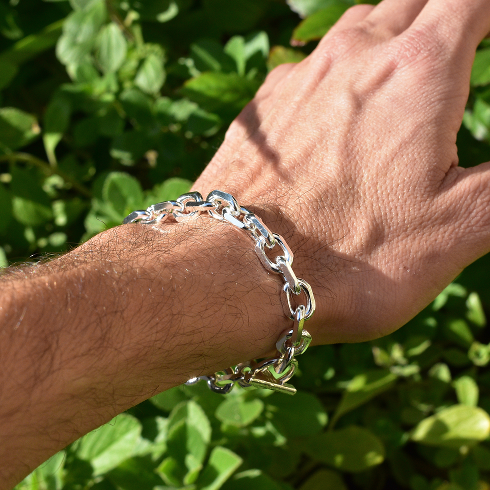 Thumbnail: Sterling silver men’s chain bracelet with bold links and toggle clasp, worn on wrist in natural light.