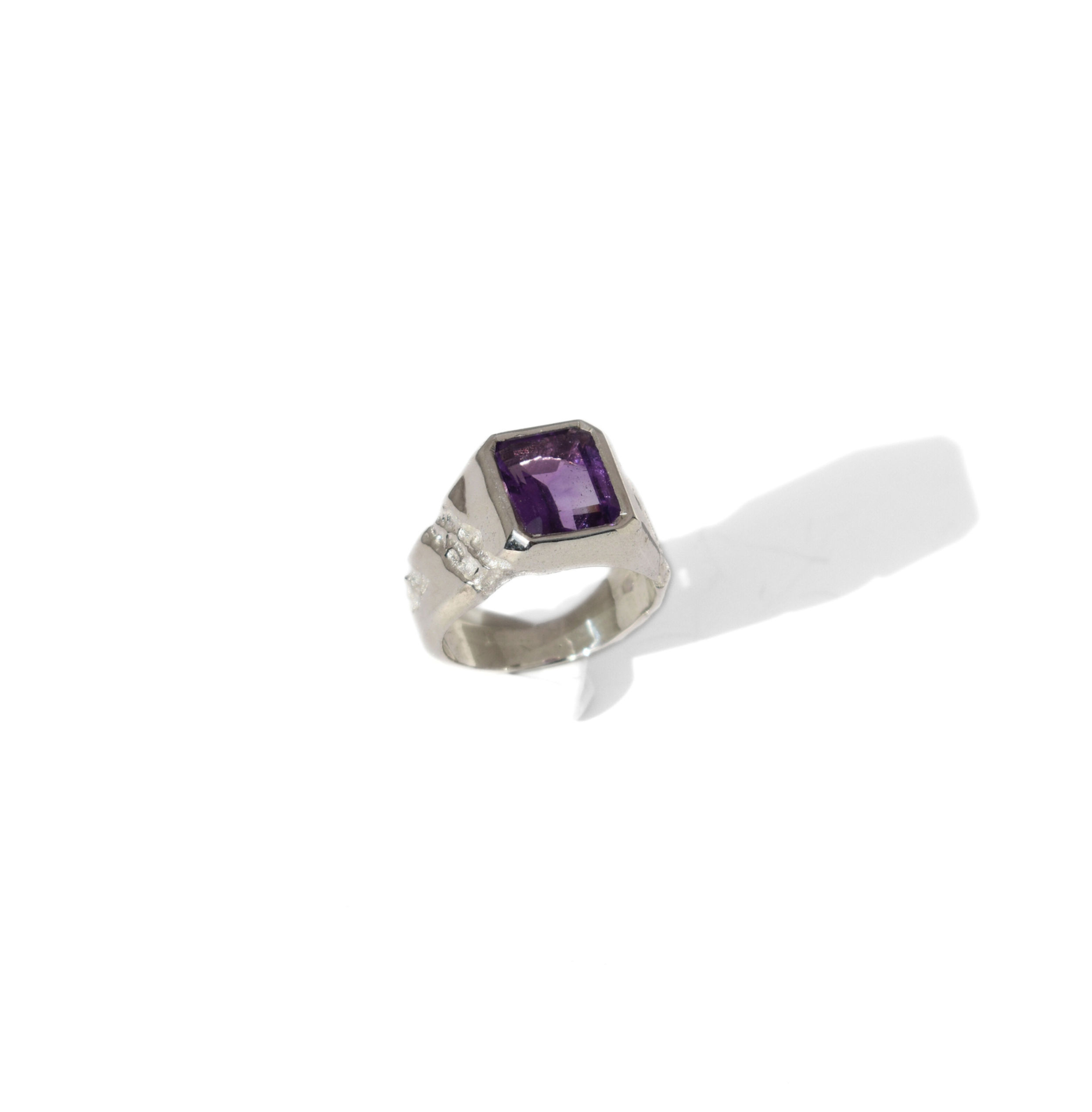 Handmade silver ring with 10x8 mm amethyst, emerald cut, bold modern design with textured band.