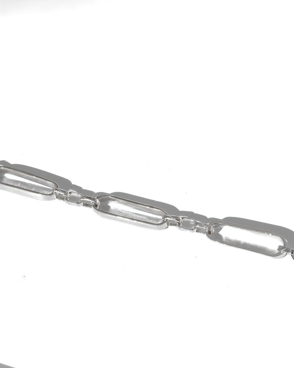 Thumbnail: Handmade sterling silver bracelet with elongated chain links, polished finish, worn on wrist in natural light.