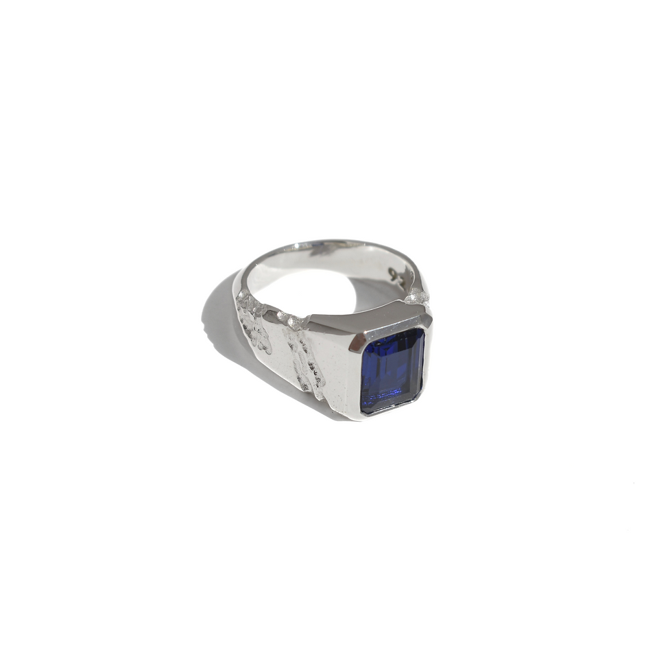 Thumbnail: Handmade silver ring with 10x8 mm lab sapphire, emerald cut, bold modern design with textured band.