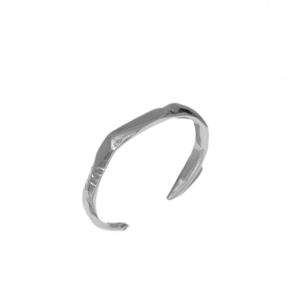 Thumbnail: Sterling silver open cuff bracelet with raw finish and carved detail lines, worn on wrist.