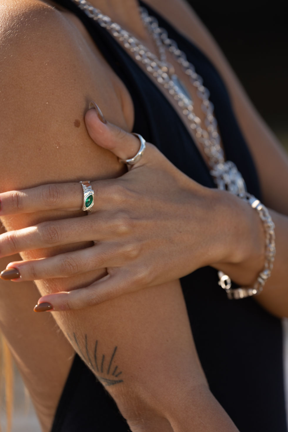 Thumbnail: Silver ring with marquise emerald and rough texture, blending raw nature with refined elegance.