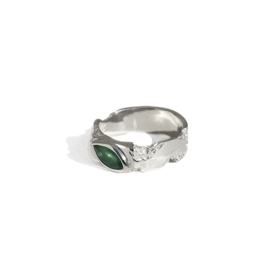 Thumbnail: Silver ring with marquise emerald and rough texture, blending raw nature with refined elegance.
