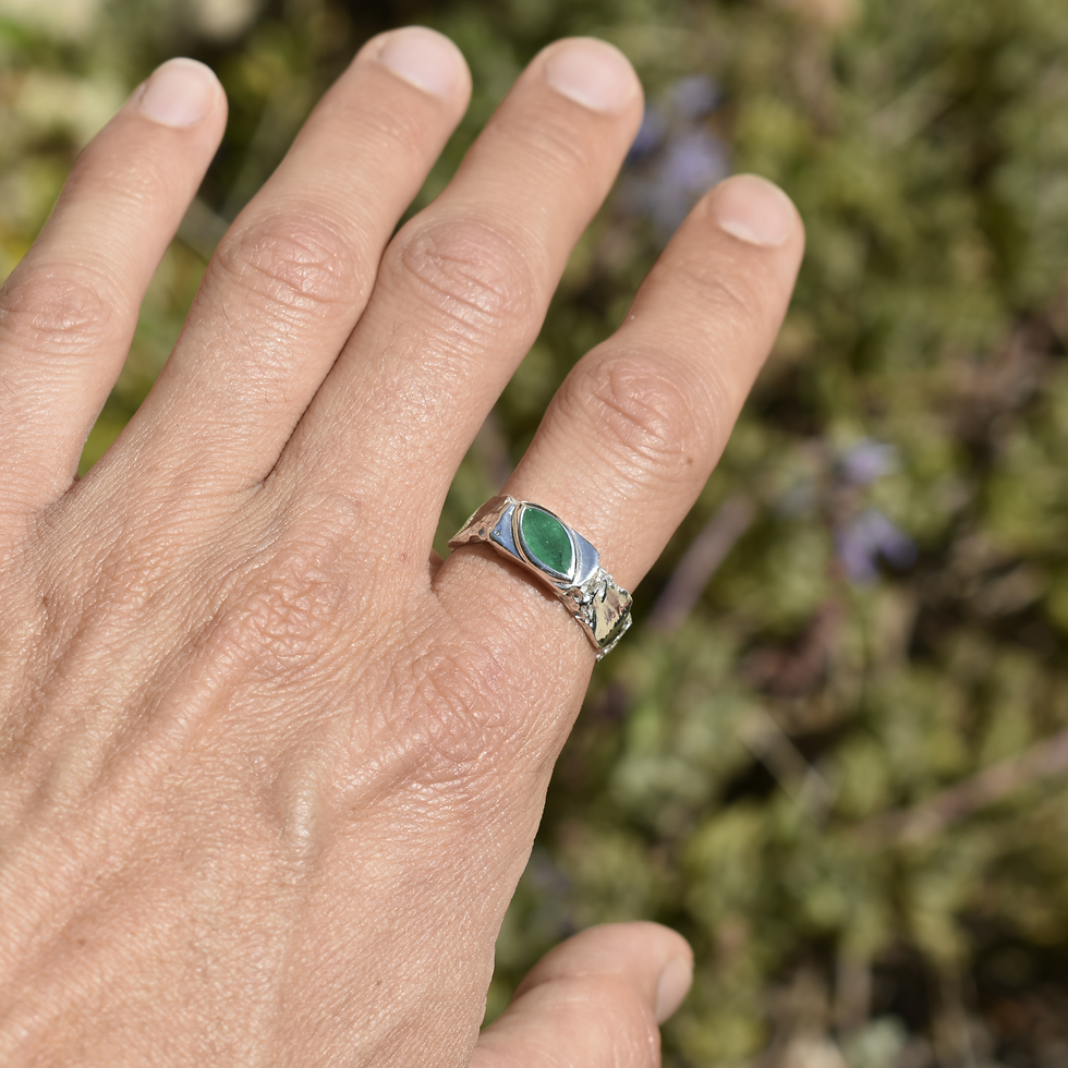 Thumbnail: Silver ring with marquise emerald and rough texture, blending raw nature with refined elegance.