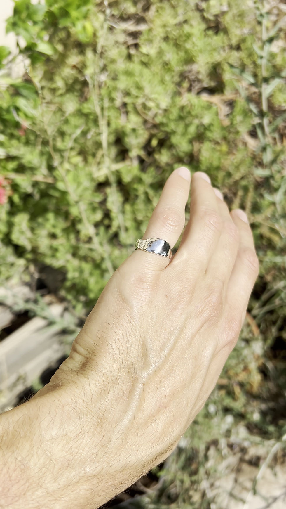 Thumbnail: Sculptural sterling silver ring with asymmetrical organic shape and polished fluid finish