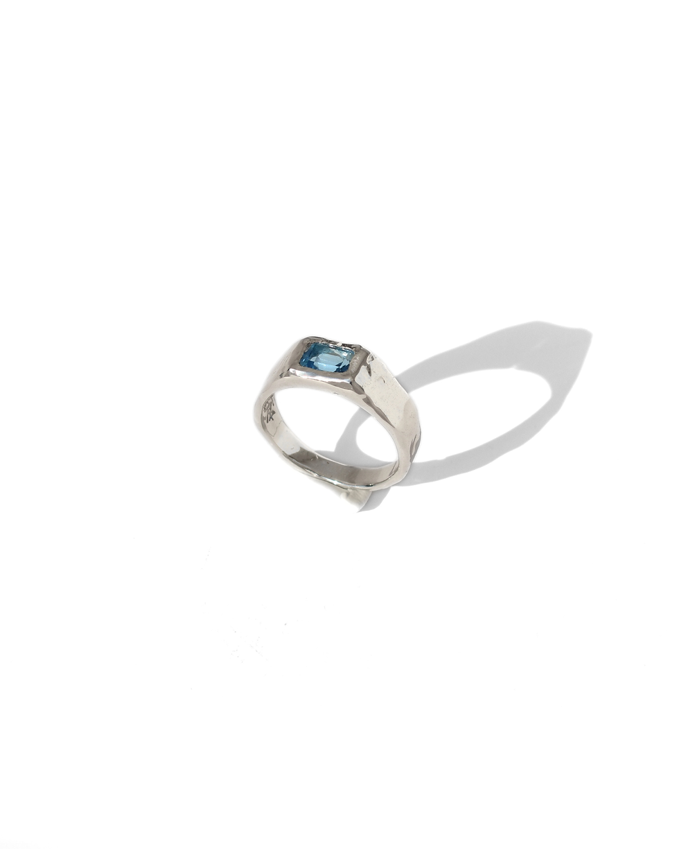 Thumbnail: Handmade sterling silver ring with rectangular blue topaz, polished organic gemstone band with sculptural silver design