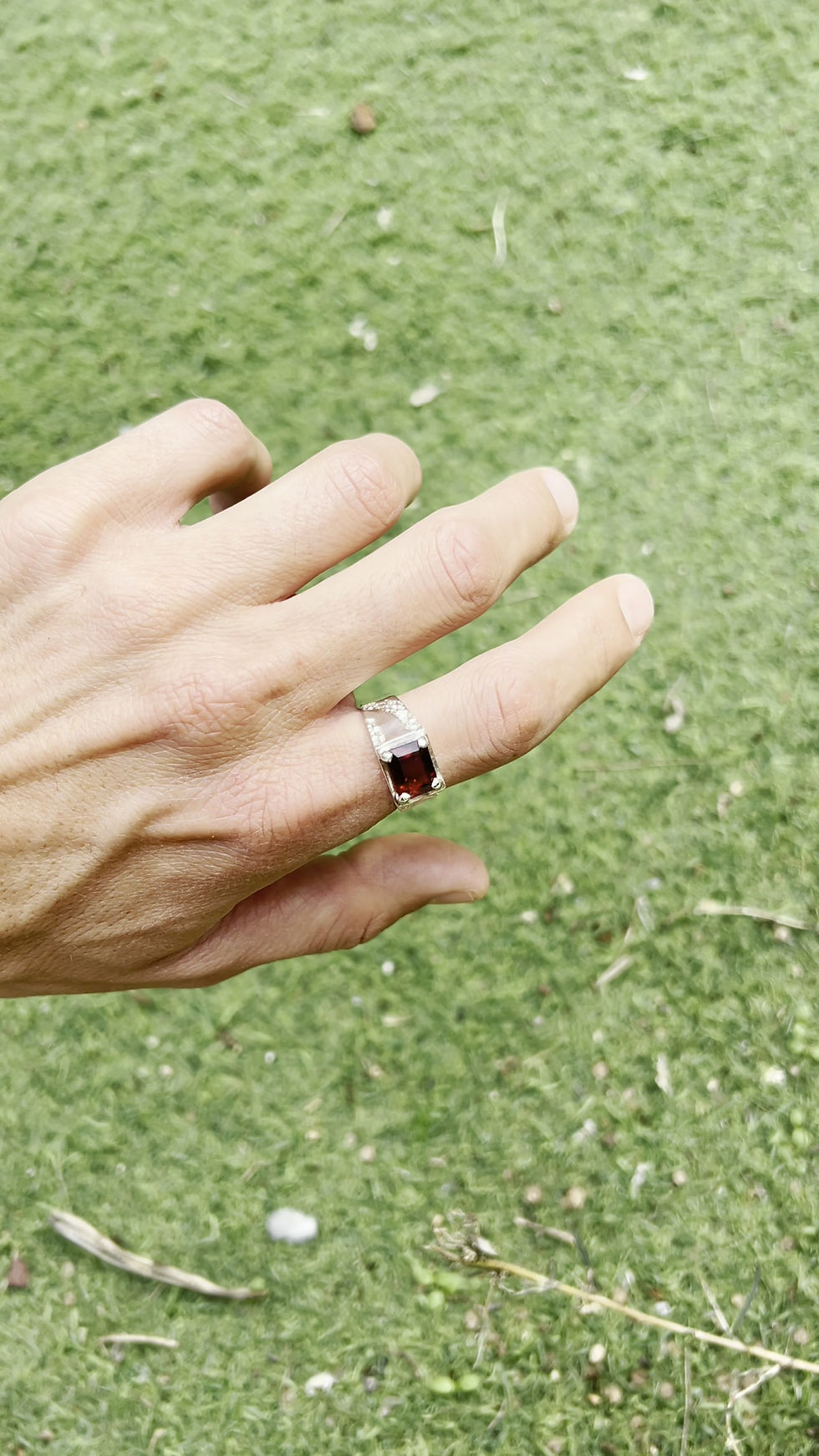 Thumbnail: Handmade silver ring with deep red garnet and molten textured band, bold rustic artisan design.