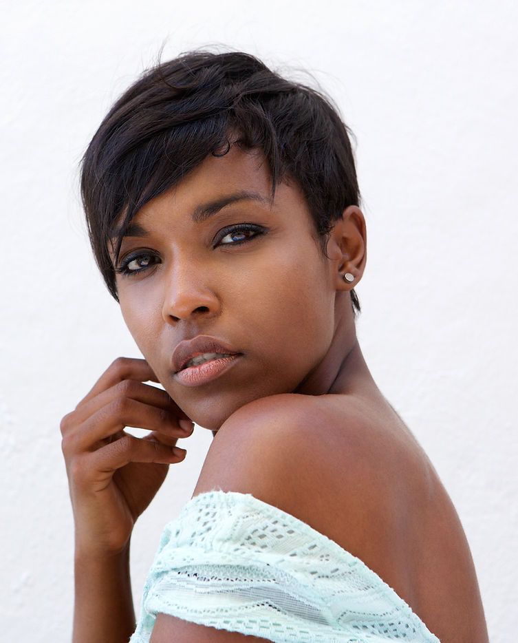 Close up side portrait of a beautiful african american fashion model with short hair.jpg