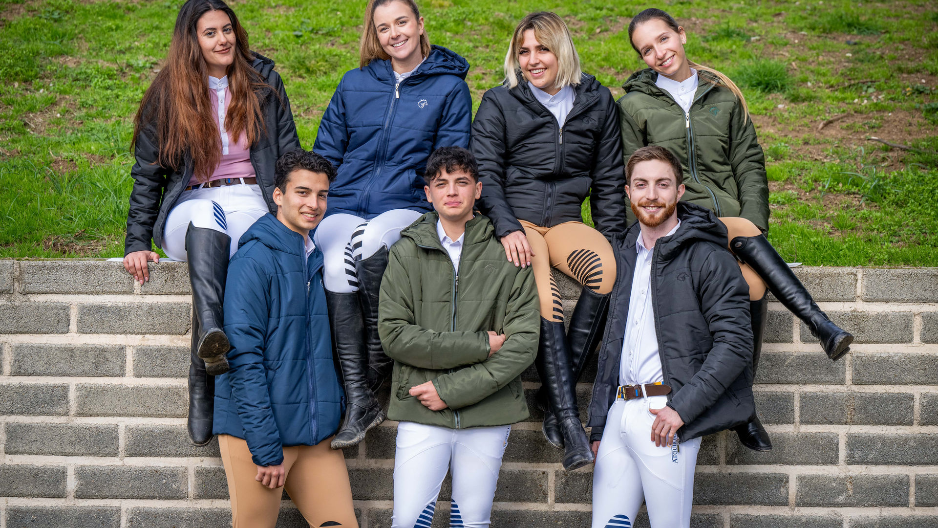 Equestrian Riders for english saddle show jumping sport, wearing puffer jackets in military green, black and navy blue, perfect for riding in the winter.
