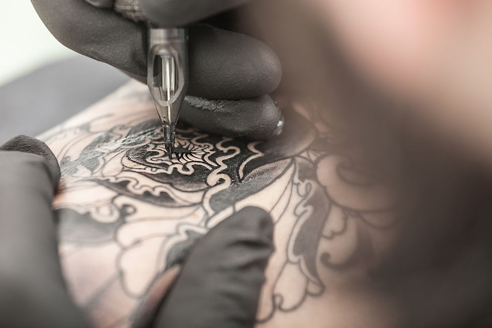 close-up of a man getting a tattoo
