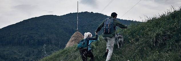 Couple Hiking with Their Dog