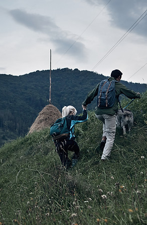 Couple Hiking with Their Dog