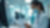 Eye-level view of a healthcare professional reviewing screening documents in a clinic