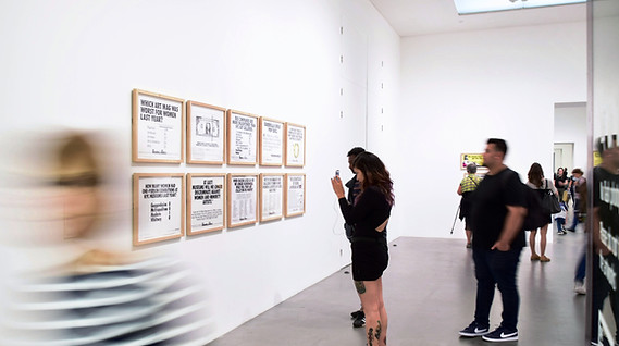 three men and woman standing while looki