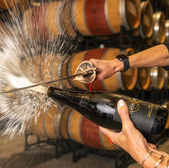 Sabering a bottle of Evolve Sparkling from the Okanagan