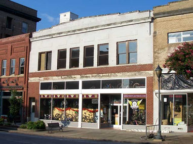 Heritage building with worn brick before restoration