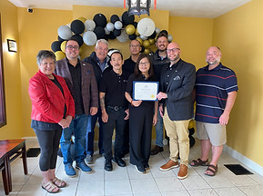 Kwong’s Chinese Restaurant owners and community members celebrating award recognition in Riverview NB.