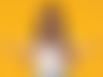 Woman looking unsure against a yellow background, illustrating hesitation when choosing a beauty clinic in North Vancouver