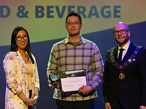 Representative from Kwong’s Chinese Restaurant in Riverview NB receiving Town of Riverview Best in Food and Beverage award.