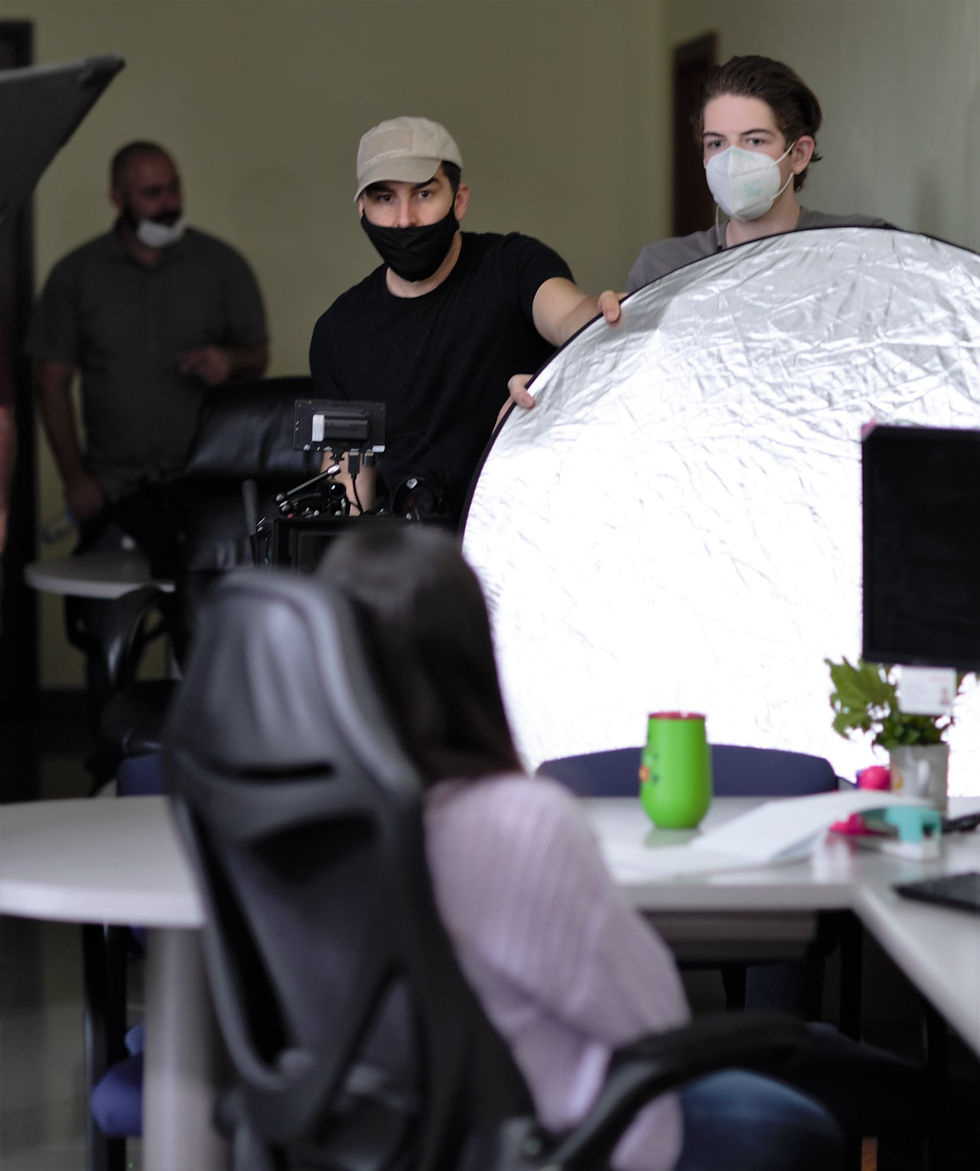 Cinematographer Zakaree and assistant Griffin Edwards setting up the look of a scene