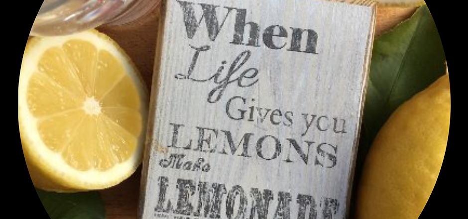 lemons and a sign that says 'when life gives you lemons, make lemonade'