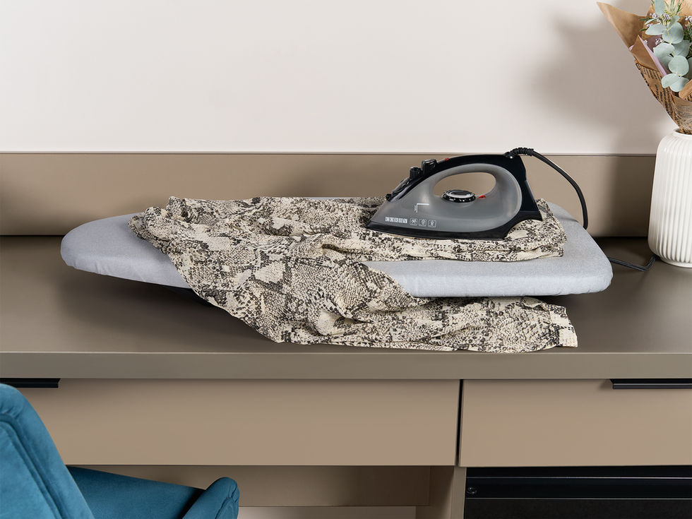 table top ironing board on hotel desk lifestyle