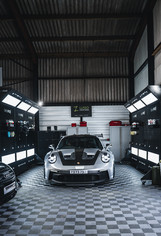Porsche 992 GT3RS receiving Gtechniq Accredited Detailing and ceramic coating with Crystal Serum Ultra, sat in some bespoke made Gtechniq Detail Pods.