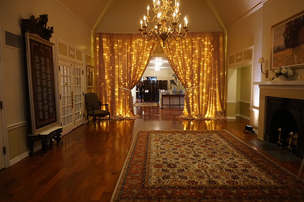 Indoor Event with Lit Curtain Draping at Entrance