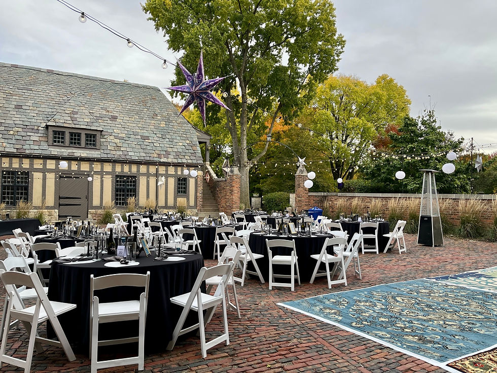 Outdoor Wedding Reception with Bulb Lights in Courtyard of Venue