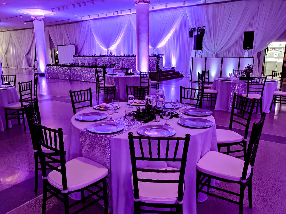 Indoor Wedding Reception with Purple Uplighting