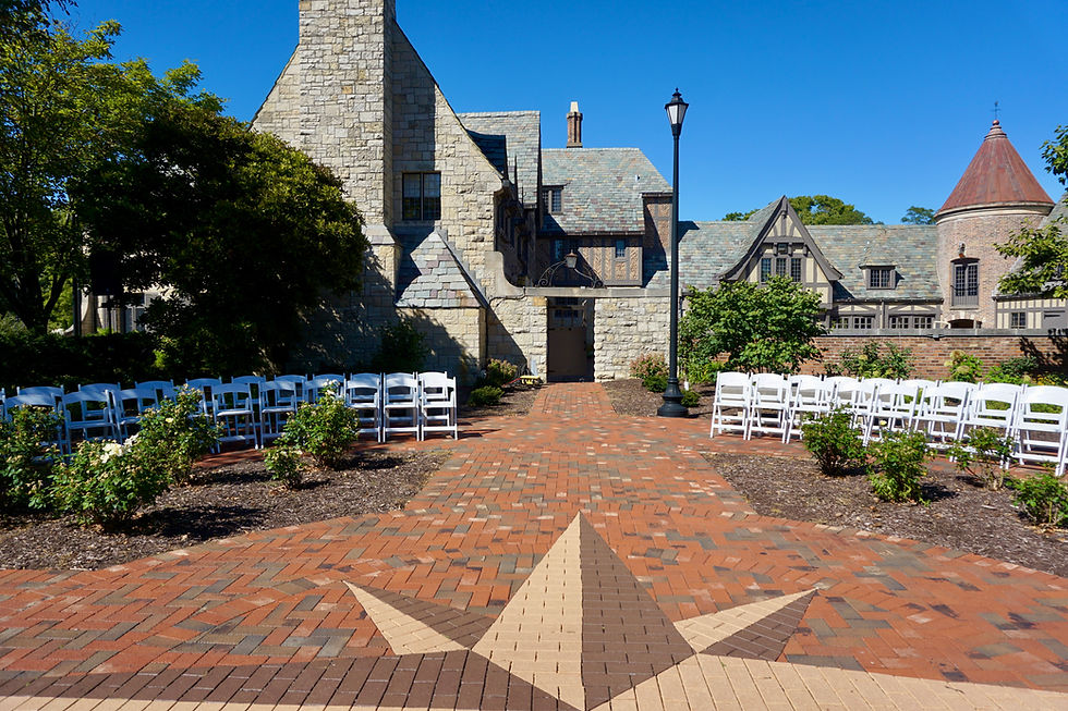 Outdoor Wedding Ceremony with White Resin Chairs