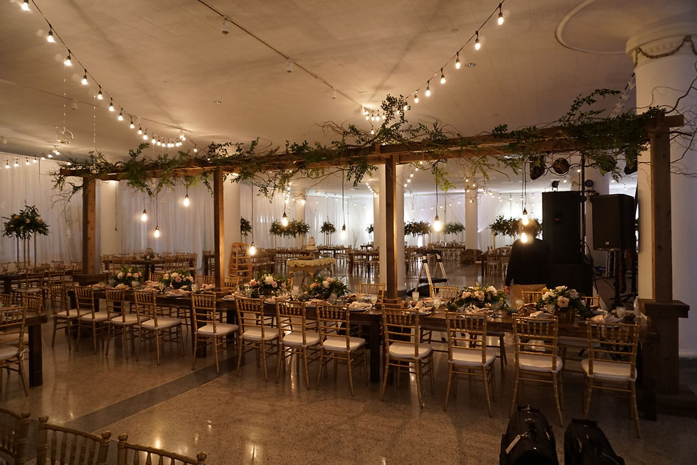 Indoor Wedding Reception with Arbors Above Head Table