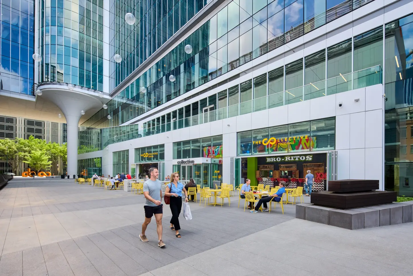 CODA building exterior with glass façades and bustling retail spaces, captured for commercial architecture photography.