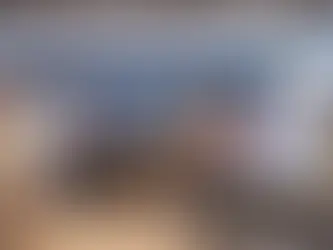 Team members connect during lunch in a stylish breakroom, highlighting community in a corporate lifestyle workplace.